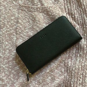 Genuine Leather Black wallet with cloth interior.